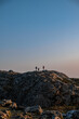 © Lucky Ev - silhouettes of people on top of the mountain at dusk, view from Bray Head, Ireland