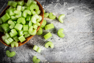 Canvas Print - Cut into small pieces of celery in a plate. 