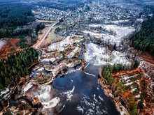 Drone View Of A Small Village During A Winter Flood, Showcasing The Destruction And Devastation Of Nature