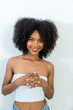 © kanpisut - Portrait of African American woman with bushy curly hairstyle