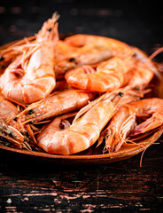 Poster - Boiled shrimp in a wooden plate. 