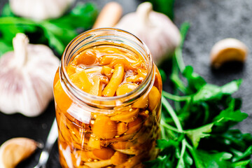 Canvas Print - Marinated mushrooms with a glass jar with parsley and garlic. 