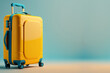 Yellow suitcase on a blue background.Travel concept, free space for text