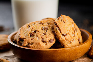 Poster - Homemade cookies with chocolate. Against a dark background