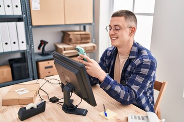 Sticker - Young hispanic man ecommerce business worker using smartphone at office