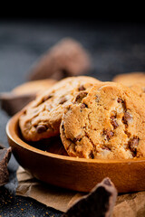 Poster - Homemade cookies with chocolate. Against a dark background