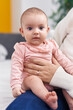 © Krakenimages.com - Adorable caucasian baby on mother hands at bedroom