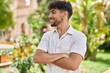 © Krakenimages.com - Young arab man smiling confident standing with arms crossed gesture at park