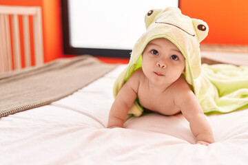 Sticker - Adorable hispanic toddler wearing funny towel lying on bed at bedroom