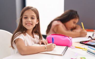 Poster - Two kids preschool students sitting on table drawing on paper at classroom