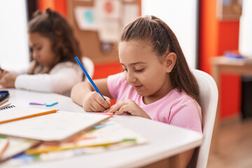 Poster - Two kids preschool students sitting on table drawing on paper at classroom