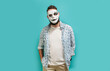 © San4ezz007 - Portrait of a man with a beard covering his face with a white mask hiding his real mysterious identity. Hypocrisy, fraud, lie and insincerity concept. Indoor studio shot against a blue background.