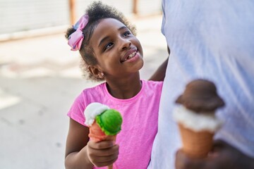 Sticker - Father and daughter eating ice cream walking together at street