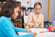 © Krakenimages.com - Two kids students sitting on table drawing on paper at kindergarten