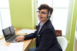 © Krakenimages.com - Non binary man call center agent smiling confident working at office