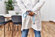 © Krakenimages.com - Young arab man wearing doctor uniform holding stethoscope at clinic