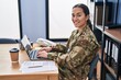 © Krakenimages.com - Young hispanic woman army soldier using laptop at office