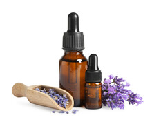 Bottles Of Essential Oil And Lavender Flowers On White Background