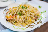Fototapeta  - Fried rice with shrimp and egg on the white dish