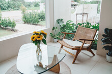 Wood Chairs And Sunflowers In A Vase On Glass Table Cafe Interior Layout In Minimal Style In Bright White Colors Open Space Interior View Of Various Coffee Welcome Open Coffee Shop Background.