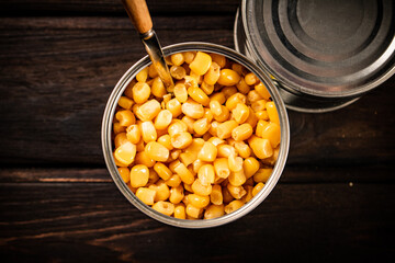 Poster - An open can of canned corn. 