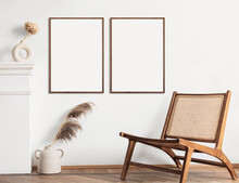 Blank Picture Frame Mockup On White Wall. Modern Living Room Design. View Of Modern Boho Style Interior With Chair, Minimalism Concept. Two Vertical Templates For Artwork, Painting, Photo Or Poster