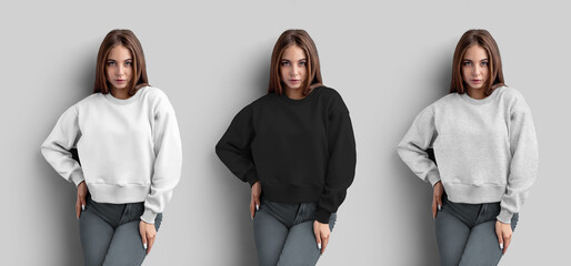 Mockup of white, black, heather crop sweatshirt on posing girl in jeans, front view, longsleeve isolated on background.