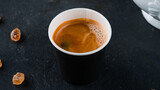 Fototapeta Mapy - A cup of hot fresh espresso coffee, black coffee in paper cup.
