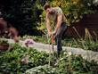 © Westend61 - Man digging in his garden using garden fork