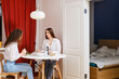 © boomeart - Woman spent night at friend's house and they have breakfast in morning together