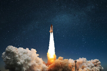 Fototapete - Space rocket with clouds of smoke and blast successfully takes off into the starry sky. Spaceship shuttle launch into space, space mission, creative idea. Science and technology, concept
