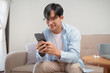 © mojo_cp - Happy Confident young asian business man use the smartphone. business successful technology concept