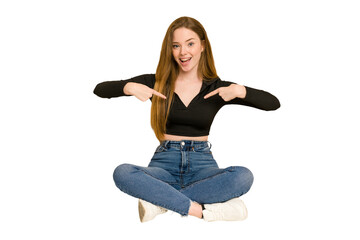 Poster - Young redhead woman sitting on the floor cut out isolated tired and very sleepy keeping hand on head.