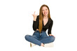 © Asier - Young redhead woman sitting on the floor cut out isolated showing thumbs up and thumbs down, difficult choose concept