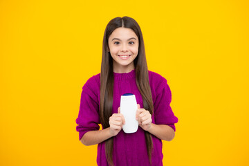 Canvas Print - Child teen girl with shampoos conditioners and shower gel. Long hair care of teenager. Presenting cosmetic product, shampoo bottle. Shampooing hair.