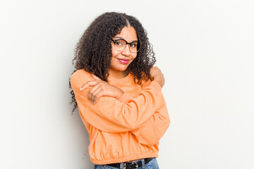 Wall Mural - Young african american woman isolated on white background hugs, smiling carefree and happy.