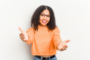 Wall Mural - Young african american woman isolated on white background showing a welcome expression.