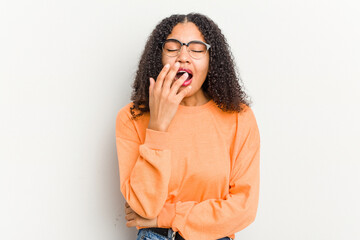 Wall Mural - Young african american woman isolated on white background yawning showing a tired gesture covering mouth with hand.