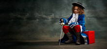 Banner With Serious Thoughtful Little Girl Wearing Costume Of Prince, Musketeer Posing Over Dark Vintage Style Background. Fashion, Theater, Beauty, Emotions Concept