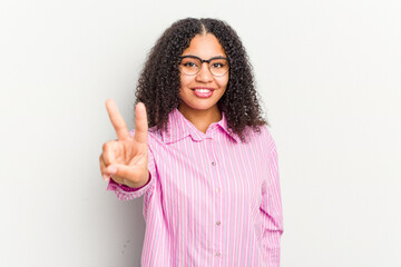 Wall Mural - Young african american woman isolated on white background showing victory sign and smiling broadly.