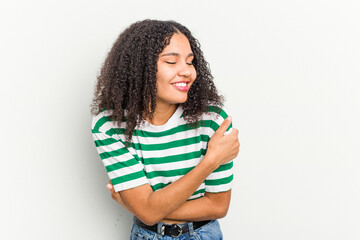 Wall Mural - Young african american woman isolated on white background laughing and having fun.