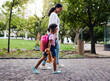 © Nina/peopleimages.com - Mother, daughter and walking in a park, relax and bonding while holding hands and talking. Family, black woman and girl with sweet bond of love, enjoying and nature, parenthood and peaceful and day