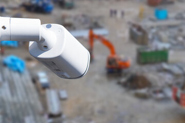 Wall Mural - security CCTV camera or surveillance system with construction site on blurry background.