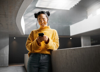 Canvas Print - Happy, woman and texting on phone in office building, relax while on internet, search and reading. Asian, girl and business entrepreneur with smartphone for research, office space or idea in Japan