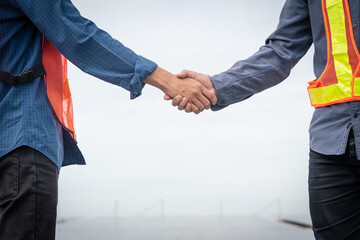 Wall Mural - People hands shake business partnership success, Shake hand concept, Shaking hands with engineers and architects agree with the success of the construction project.