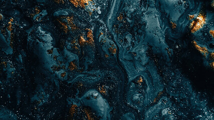 Wall Mural - Sparkling fluid. Abstract background. Ink mix. Defocused shiny blue silver golden color glitter particles texture paint wave dark abstract background.