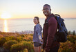 © Nina/peopleimages.com - Portrait, wellness and hiking interracial couple exercise in sunset on a mountain as a morning workout in nature. Fitness, man and woman in a relationship training for health and wellness together