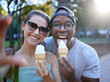 © Nina/peopleimages.com - Love, ice cream or couple take a selfie in a park on a romantic date in nature in an interracial marriage. Pictures, black man or happy woman eating or enjoying a snack on holiday vacation