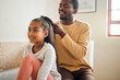 Leinwandbild Motiv Family, black father and help girl with hair, smile and bonding together in bathroom, relax and conversation. Love, dad and daughter with hairstyle, happiness or loving with kid and child development