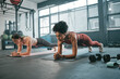 © Delcio/peopleimages.com - Women, plank and gym fitness friends with cardio exercise, workout and body wellness. Motivation, woman focus and challenge of people in sports training and athlete class exercising for health